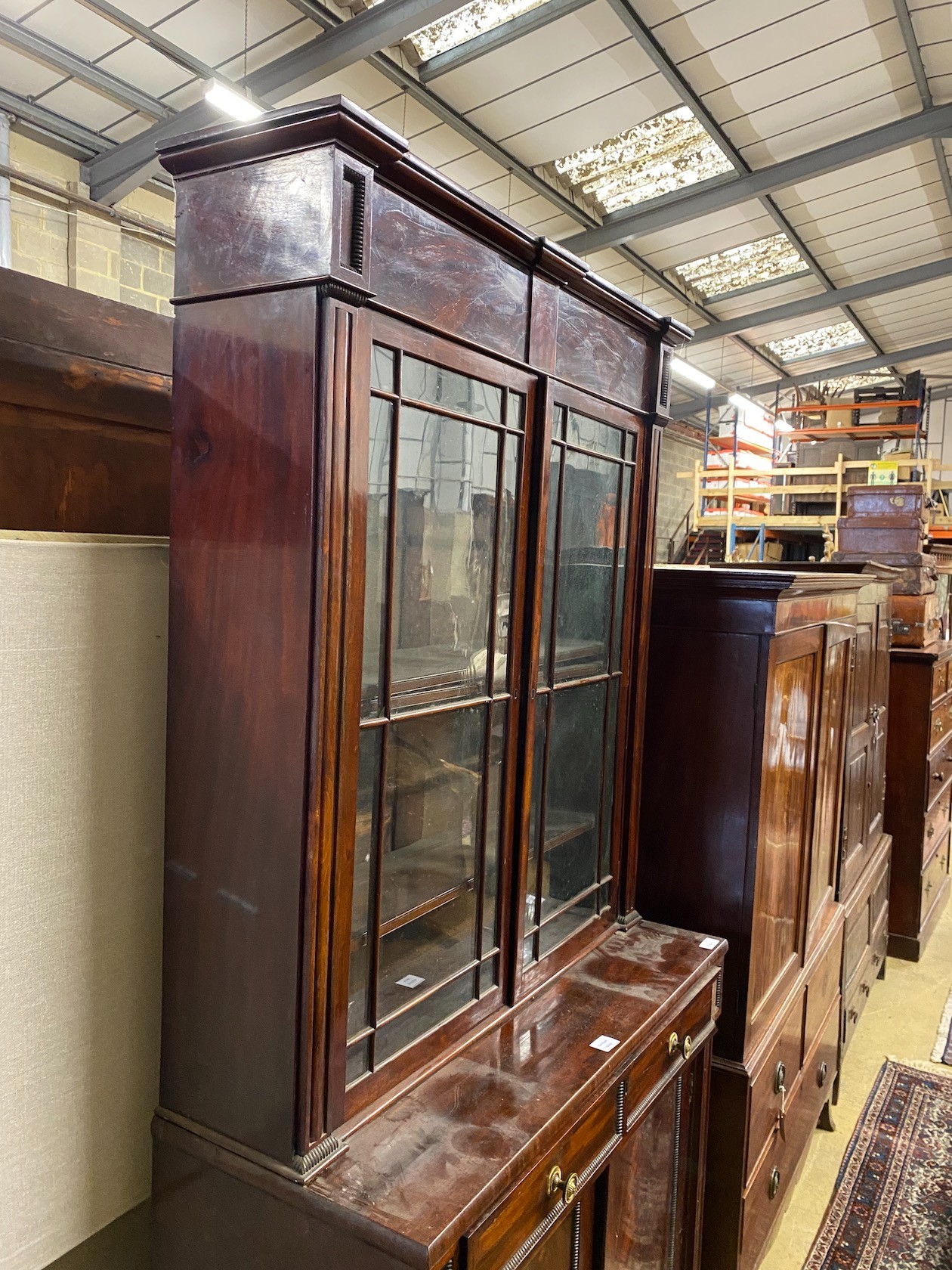 A Regency mahogany bookcase / cupboard, width 106cm, depth 44cm, height 226cm